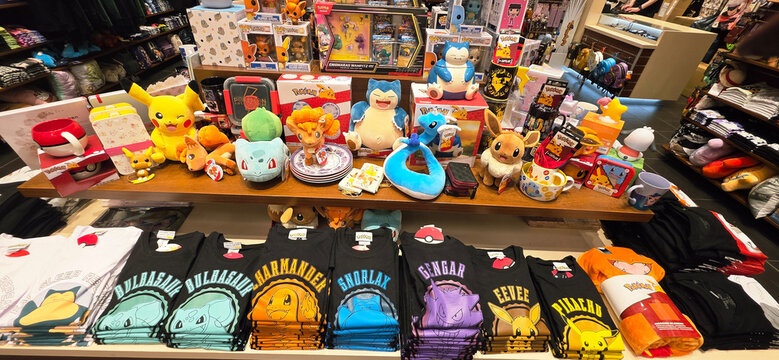 Colorful Pokemon merchandise display with plush toys and apparel