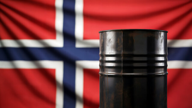 A realistic photograph of a black steel oil barrel positioned prominently in the foreground against a crisp Norwegian flag backdrop. The barrel shows weathered industrial details with metal ridges and - Powered by Adobe