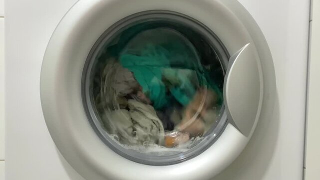 Cleaning hospital uniforms using industrial washing equipment
