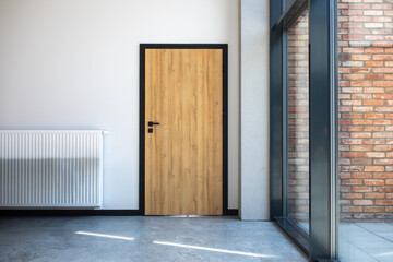 Designer entrance door to building. Modern design. luxurious exterior. Facade of a modern building with modern doors.