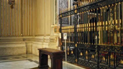 Ornate church interior with decorative iron grille and marble floor, defocused soft bokeh background church; background backplate copyspace template calm.
