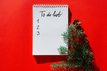 Blank open notebook mock up, to do list, wishlist for Santa, New year and Christmas goals. Christmas eve branch, dried orange, gift. Flat lay, top view, place for text