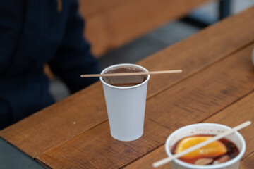 Takeaway Hot Drinks on Wooden Outdoor Table