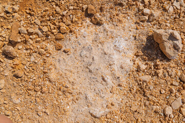 Dry earth with rocks and sand patterns at desert terrain. Close-up of natural rock with crystal formations