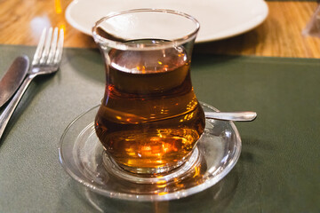 Baku, Azerbaijan. Azerbaijani black tea in armudu tea glass.