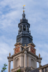 Obraz premium XVII century Protestant Southern church (Zuiderkerk) - in Amsterdam Nieuwmarkt area. Southern Church built in 1611 and church tower in 1614, dominates the surrounding area. Amsterdam. The Netherlands.