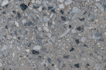 Old dirty outdoor floor texture made of worn terrazzo material