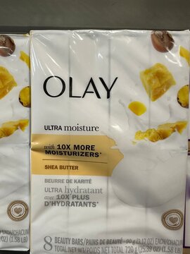 Olay Cleansing and Nourishing bar soap displayed on a retail shelf, featuring purple and yellow packaging accents for skincare products. November 14 2025, Alberta Canada.