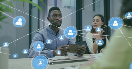 Man holding tablet speaking, gesturing in business meeting, network growing, handshake sealing deal - Powered by Adobe