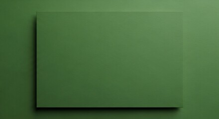 A smooth, square surface of a deep, muted green, casting a subtle shadow on a slightly textured, darker green background, creating a minimalistic and sophisticated aesthetic