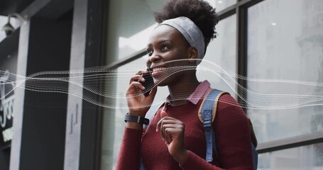 Student answering phone outside glass, waveform moving as smiling and checking education plan