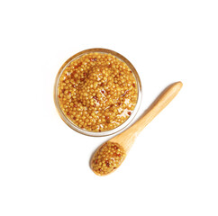 a bowl of mustard sauce on a white background