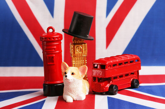 symbols of Great Britain against the background of the country's flag