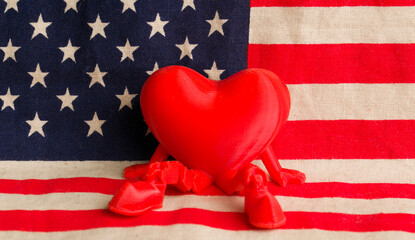 A figurine of a sardine against the backdrop of the US flag