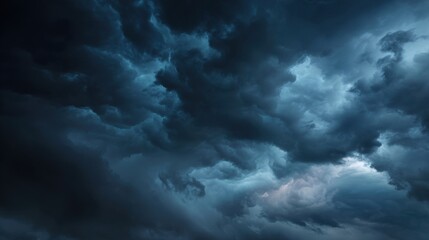 Dark and Dramatic Cloudy Sky with Heavy Storm Clouds Illuminated by Soft Light and Atmospheric Hues Creating a Moody and Mysterious Atmosphere