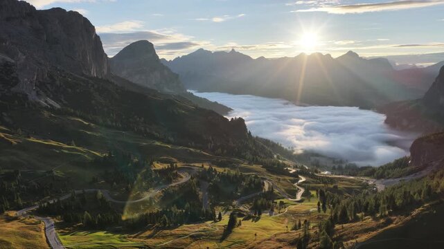 Cinematic aerial video of Gardena Pass in the Italian Dolomites during morning golden hour