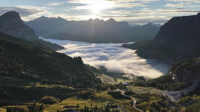 Cinematic aerial video of Gardena Pass in the Italian Dolomites during morning golden hour