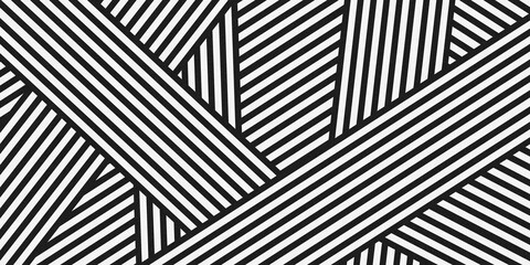 Bold black and white abstract geometric background with thick diagonal lines intersecting to form sharp triangular shapes, creating a dynamic, high-contrast optical illusion pattern.