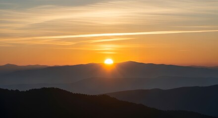 Sunset Over Mountain Range with Vibrant Sky and Layered Hills