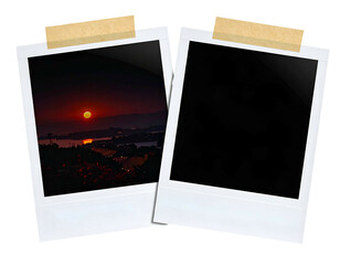 Two framed photos, one with sunset, other empty