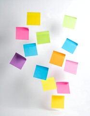 Colorful sticky notes float against a white background, representing ideas and memos