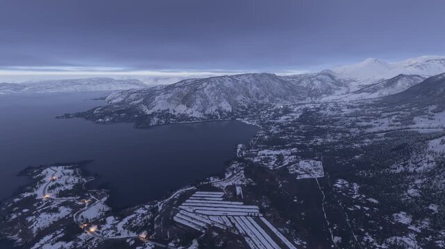 Side aerial drone view of the snow in Narsaq. Kujalleq. Greenland