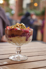 Delicious dessert served in a glass cup at an outdoor cafe