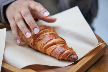 Enjoying a fresh croissant at a local bakery