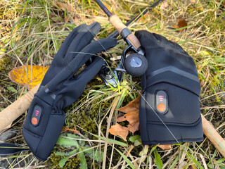 Water proof heated gloves for fishing in cold weather during the late autumn fall winter season