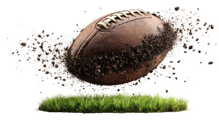 Football soars, scattering dirt above grass