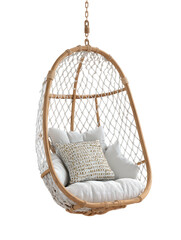 Wicker hanging chair with pillows, dangling gently in mid-air