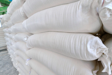 Flour sack storage facility with neatly packed sacks arranged for easy access and inventory...
