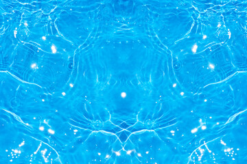 Blue water with ripples on the surface. Defocus blurred transparent blue colored clear calm water surface texture with splashes and bubbles. Water waves with shining pattern texture background.