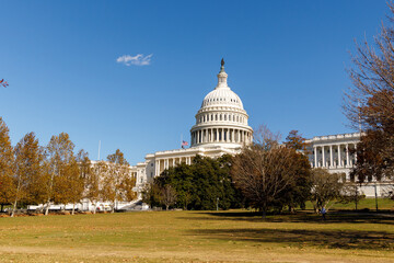 A sunny autumn day in Washington, DC. The White House stands amid autumn trees. The US government  shut down. Memorial Day in capital of USA.