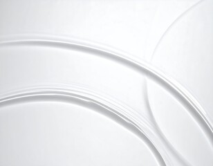 A smooth, abstract design with fluid, curving lines in varying shades of white and gray, creating depth and movement