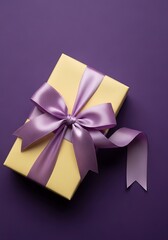 A beautifully wrapped yellow gift box adorned with a large, elegant lavender satin bow and ribbon, set against a solid purple background.