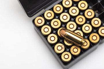 .45 ACP bullet pistol gun with ammunition box on white background