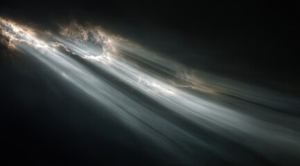 Rays of light pierce dramatic dark clouds from above