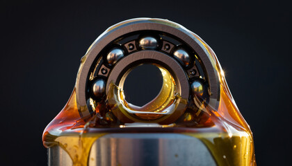 Ball bearing in yellow grease- yellow industrial lubricant