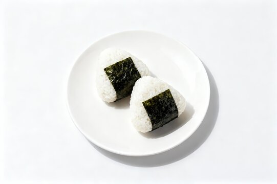 Japanese onigir on plate on a white isolated background.