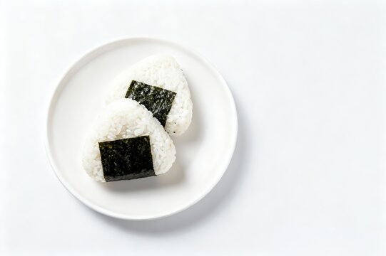 Japanese onigir on plate on a white isolated background.