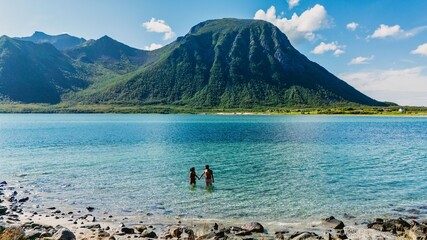 Breathtaking summer day at the shores of Lofoten, Norway with stunning mountains in the background