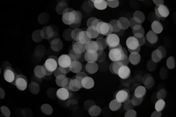 Fototapeta premium Bright, colorful, and defocused bokeh lights form an abstract background pattern for a glowing Christmas holiday celebration design