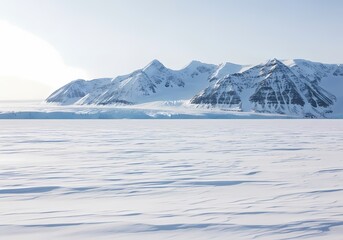 Snow-covered mountains and icy landscape under a clear sky