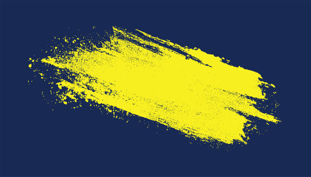 Bright yellow abstract paint splash texture on a dark navy blue background with rough edges and scattered dots