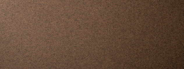 ザラザラした質感のある焦茶色の紙の背景テクスチャー