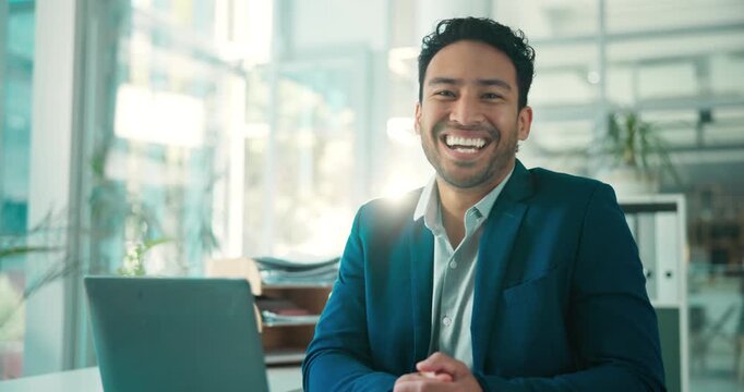 Face, financial advisor and happy man in office, laptop and career ambition with confidence. Asian person, investor and employee in workplace, computer and pride with trading portfolio and internet