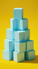 Obraz premium Pyramid of light blue cubes on yellow. Minimalist