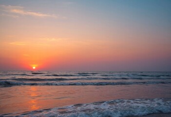 Fototapeta premium Orange glow on the calm tide line, the sky and sea at sunset