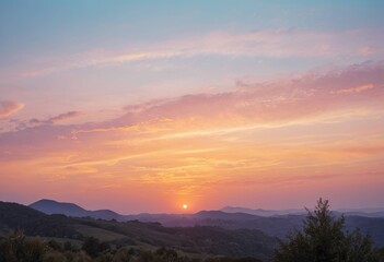 Fototapeta premium Pastel Sky and Sunrise (or Sunset) over a Mountain Range